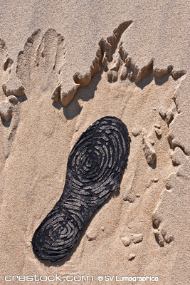 lost boot on sand at the beach lost boot on sand at the beach